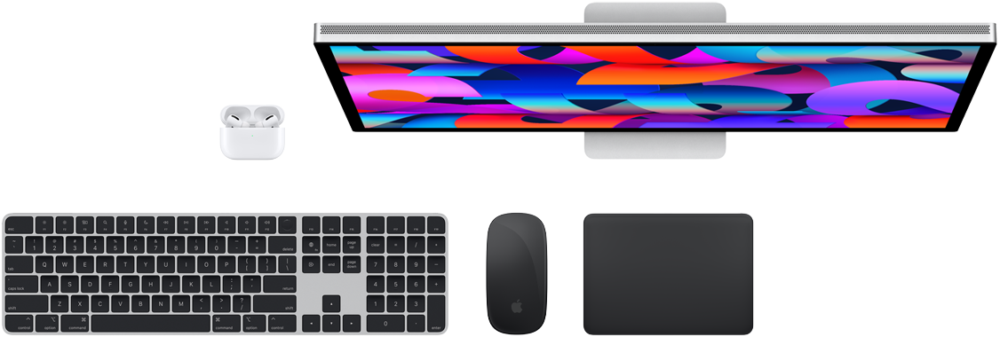 Top view of AirPods, Studio Display, Magic Keyboard, Magic Mouse, and Magic Trackpad